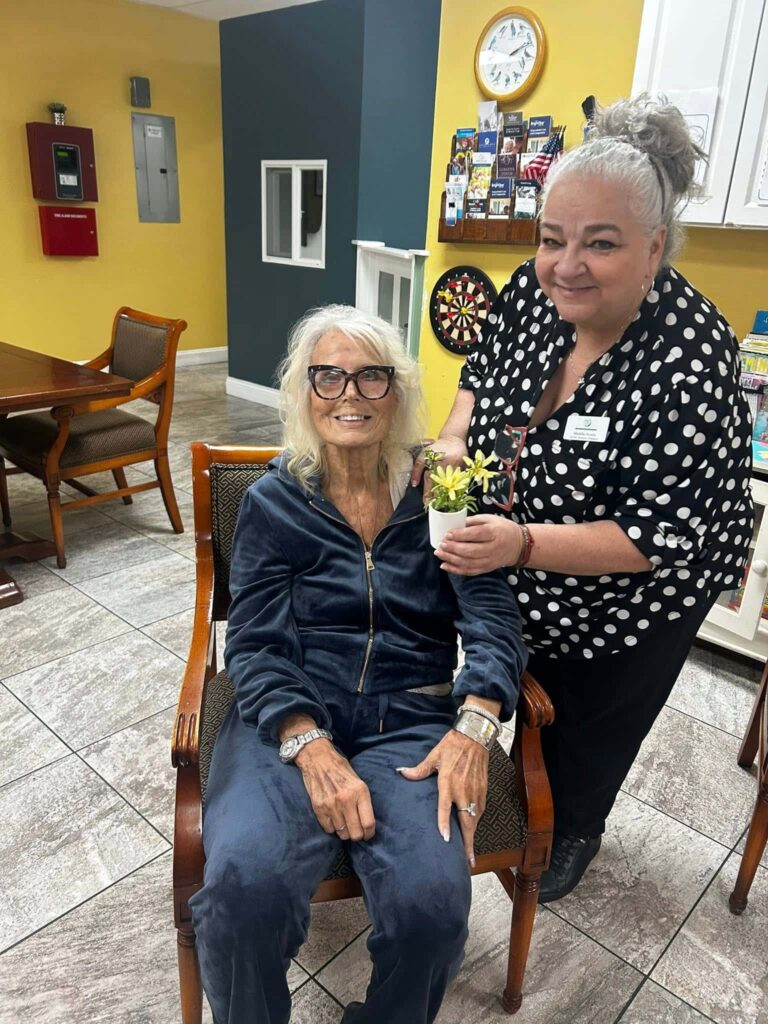 Caregiver and senior enjoying companionship at adult day care in Cape Coral